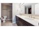 Bathroom featuring dual vanity, tile floors and lots of storage space at 6545 S Balsam Ct, Littleton, CO 80123