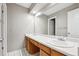 Bathroom featuring a large vanity, dual sinks and a large mirror at 6545 S Balsam Ct, Littleton, CO 80123