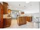Spacious kitchen with granite countertops, stainless steel appliances, tile flooring and custom cabinets at 6545 S Balsam Ct, Littleton, CO 80123