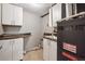 Functional utility room with ample storage, sink, and modern furnace at 6545 S Balsam Ct, Littleton, CO 80123