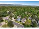 Scenic aerial view of the neighborhood with lush greenery and mountain views in the background at 5523 Stonewall Pl, Boulder, CO 80303