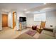 Basement living space featuring a media area with a TV and comfortable seating at 5523 Stonewall Pl, Boulder, CO 80303