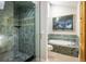 Modern bathroom featuring a glass shower and a luxurious soaking tub at 5523 Stonewall Pl, Boulder, CO 80303