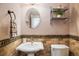 Charming powder room with decorative sink and tile accents at 5523 Stonewall Pl, Boulder, CO 80303