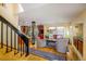Open-concept living room featuring wood floors, a staircase, and adjacent kitchen at 5523 Stonewall Pl, Boulder, CO 80303