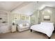 Bright main bedroom featuring a sitting area, carpet flooring, and ample natural light at 5523 Stonewall Pl, Boulder, CO 80303