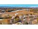 Scenic aerial view of a residential area with snow-capped mountains in the distance at 32 Silver Fox Cir, Greenwood Village, CO 80121