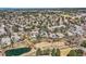Aerial view of the community with mature trees, ponds, and well-maintained landscaping at 32 Silver Fox Cir, Greenwood Village, CO 80121