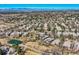 Beautiful aerial view of the neighborhood featuring mature trees, green spaces, and mountain views at 32 Silver Fox Cir, Greenwood Village, CO 80121