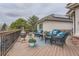 Inviting back deck area with a gas grill and outdoor furniture at 32 Silver Fox Cir, Greenwood Village, CO 80121