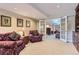 Cozy basement seating area with easy access to the rest of the home with French doors at 32 Silver Fox Cir, Greenwood Village, CO 80121
