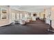Spacious community lounge area with neutral tones, seating, and multiple windows for natural light at 32 Silver Fox Cir, Greenwood Village, CO 80121