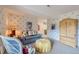 Bright living room featuring a comfortable sofa and a decorative cabinet at 32 Silver Fox Cir, Greenwood Village, CO 80121