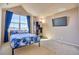 Bedroom with a bed, a window, and a television set at 621 N Pines Trl, Parker, CO 80138