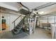 Unfinished basement with stairs, mechanicals, and utility sink at 1376 Ivanhoe St, Denver, CO 80220
