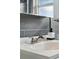 Close-up of a stylish bathroom sink with sleek fixtures, highlighting modern design and functionality at 1376 Ivanhoe St, Denver, CO 80220
