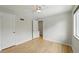 Bright bedroom with hardwood floors, white trim, and a ceiling fan at 1376 Ivanhoe St, Denver, CO 80220