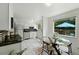 Bright eat-in kitchen with stainless steel appliances and a view of the backyard patio, great for entertaining at 1376 Ivanhoe St, Denver, CO 80220