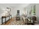 Bright living room with hardwood floors, large window, and stylish decor, creating a cozy atmosphere at 1376 Ivanhoe St, Denver, CO 80220