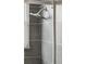 Close-up of gray tiled shower with modern showerhead at 1376 Ivanhoe St, Denver, CO 80220
