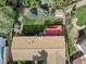 Aerial view of the home shows the roof, fenced backyard, shed, patio, and deck at 207 Short Pl, Louisville, CO 80027