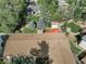 A beautiful backyard with mature trees, red deck, privacy fence and large roof at 207 Short Pl, Louisville, CO 80027