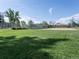 Outdoor recreation area with well-maintained green grass, a tennis court, and basketball court at 207 Short Pl, Louisville, CO 80027