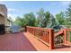 Spacious deck features an outdoor grill, red wood flooring, and a beautiful backyard view at 207 Short Pl, Louisville, CO 80027