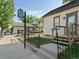 Quaint Historical Museum with inviting entrance, wrought iron fence, and mature trees at 207 Short Pl, Louisville, CO 80027