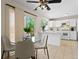 Bright kitchen with a breakfast nook, sliding door, and ample countertop space at 207 Short Pl, Louisville, CO 80027