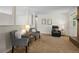 Inviting living room with comfortable seating, warm lighting, and view of a fireplace and a cozy recliner at 207 Short Pl, Louisville, CO 80027