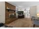 Spacious living room featuring a brick fireplace, comfortable seating, and an open view to the kitchen at 207 Short Pl, Louisville, CO 80027