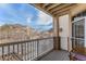 A balcony with white railings and a view of the surrounding neighborhood at 5694 N Gibralter Way # 203, Aurora, CO 80019