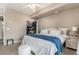 Bedroom featuring a walk-in closet with organization, and comfortable furniture and natural light at 5694 N Gibralter Way # 203, Aurora, CO 80019