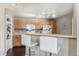 Eat-in kitchen with wood cabinetry and appliances; great for casual meals at 5694 N Gibralter Way # 203, Aurora, CO 80019