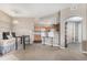 Spacious living area flowing into the kitchen and dining area, great for entertaining at 5694 N Gibralter Way # 203, Aurora, CO 80019