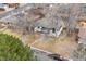 An aerial view of a charming single-Gathering home with professionally maintained landscaping and mature trees at 2610 S Cherry St, Denver, CO 80222