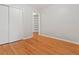 Bedroom boasts hardwood floors, closet, neutral colors, and natural light at 2610 S Cherry St, Denver, CO 80222