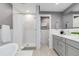 Modern bathroom with a tile shower, soaking tub, and neutral gray color palette at 1588 Blackwood Ct, Erie, CO 80516