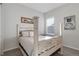 Bright bedroom with a decorative bed frame, natural light, and decorative artwork at 1588 Blackwood Ct, Erie, CO 80516