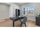 Home office featuring a stylish desk, a comfortable chair, and lots of natural light at 1588 Blackwood Ct, Erie, CO 80516