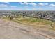 Expansive aerial view showcases the community's lush green space, park, and surrounding neighborhood at 1603 S Flanders Way, Aurora, CO 80017