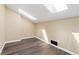 Attic space with wood flooring and a skylight at 1603 S Flanders Way, Aurora, CO 80017