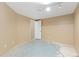 Unfinished basement area showcasing concrete floors, neutral walls, and lighting fixtures at 1603 S Flanders Way, Aurora, CO 80017
