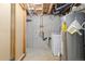 Unfinished basement featuring washer, dryer, water heater and exposed piping at 1603 S Flanders Way, Aurora, CO 80017