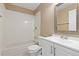 Bright bathroom featuring a shower-tub combination and a white single sink vanity at 1603 S Flanders Way, Aurora, CO 80017