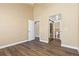 Bedroom with hardwood floors, neutral color scheme, and a walk in closet at 1603 S Flanders Way, Aurora, CO 80017