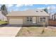 Ranch-style home featuring a one-car garage, neutral color palette, and a well-maintained lawn at 1603 S Flanders Way, Aurora, CO 80017