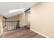 Hallway with wood flooring and a staircase with a skylight at 1603 S Flanders Way, Aurora, CO 80017