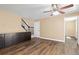 Spacious living room featuring wood floors, storage, and staircase at 1603 S Flanders Way, Aurora, CO 80017